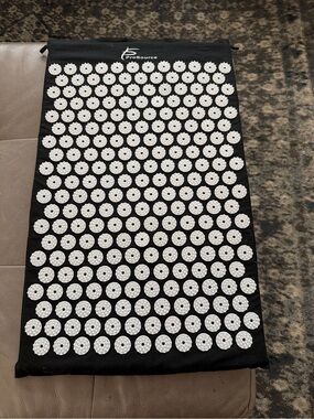 Black Acupressure Mat with White Massage Nodes